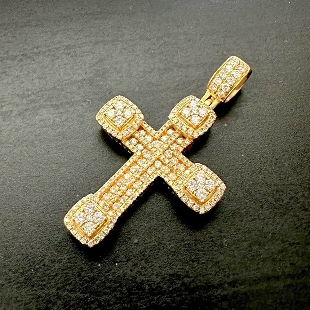 10k solid gold cross .8 carats in VS diamonds. No chain included. Pendant only